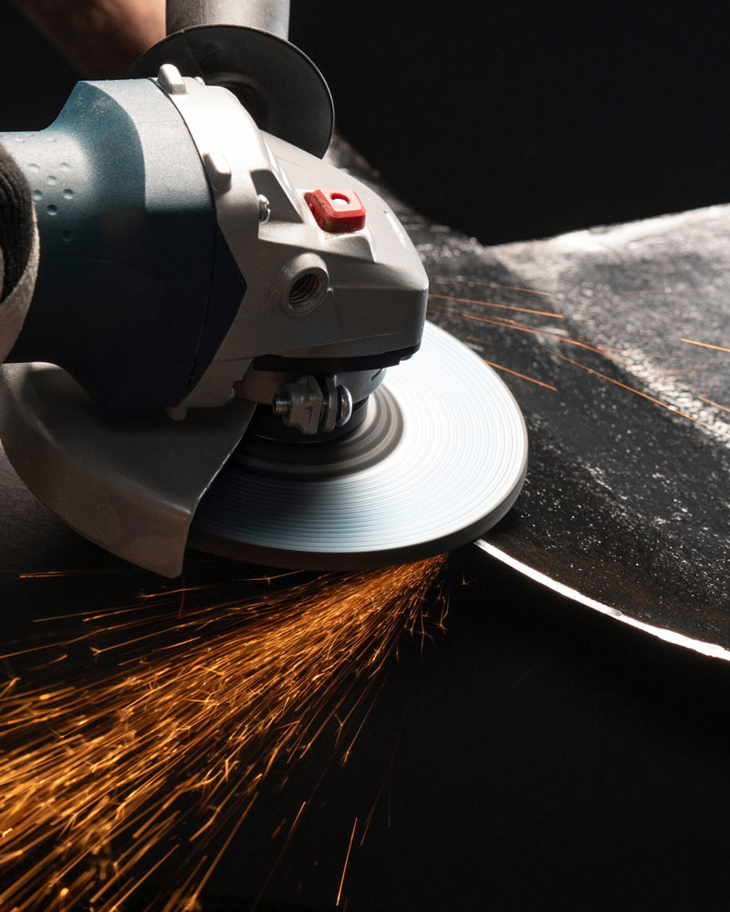 Grinding a knife edge with a hand held grinder.