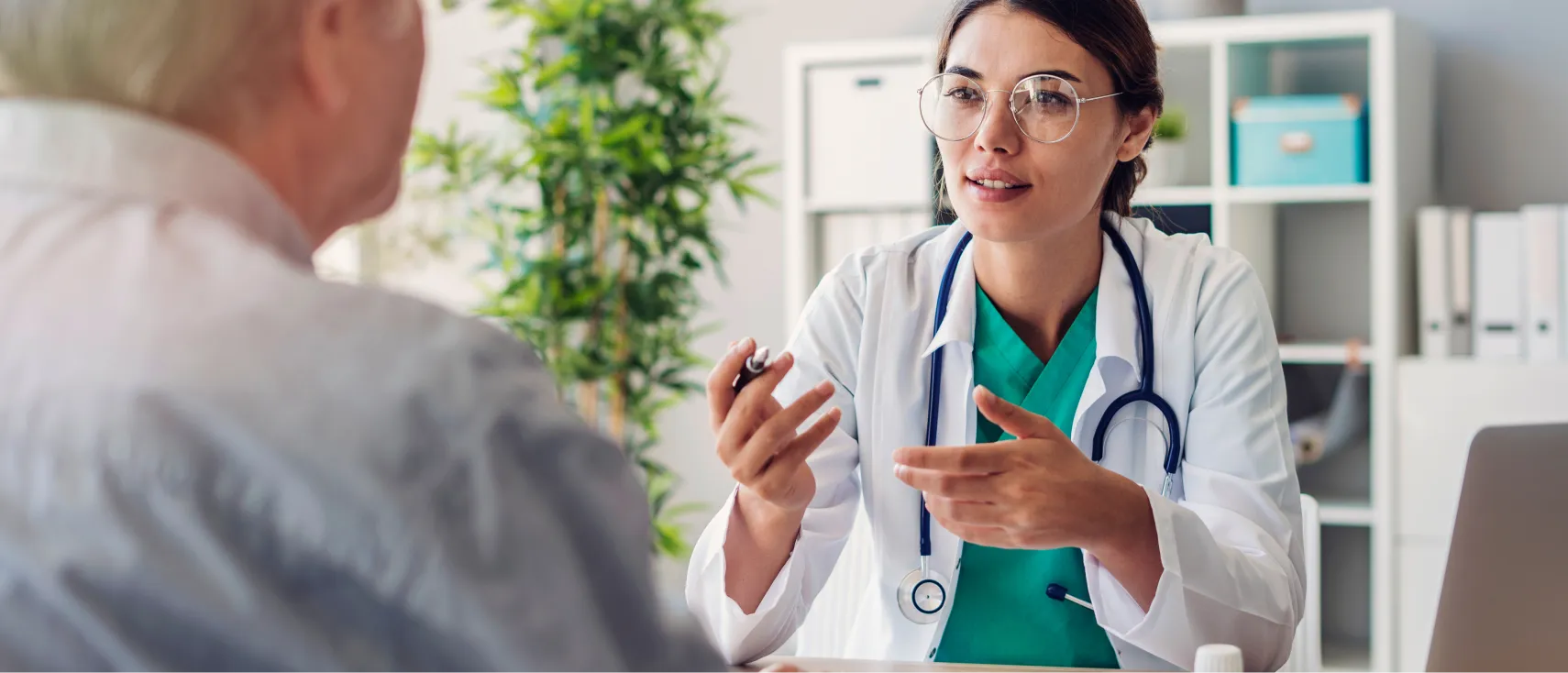 A female doctor talking with a man