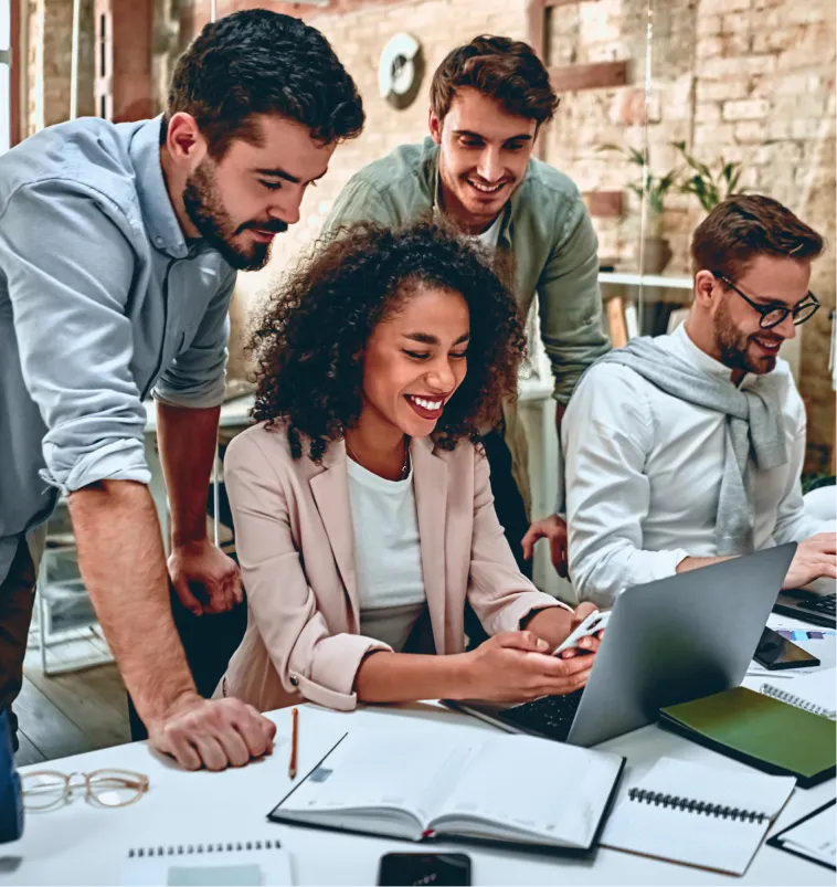 A business team planning their work on a laptop