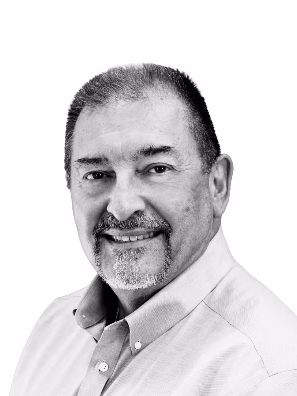 Smiling middle-aged man with short hair and a goatee wearing a checked shirt.