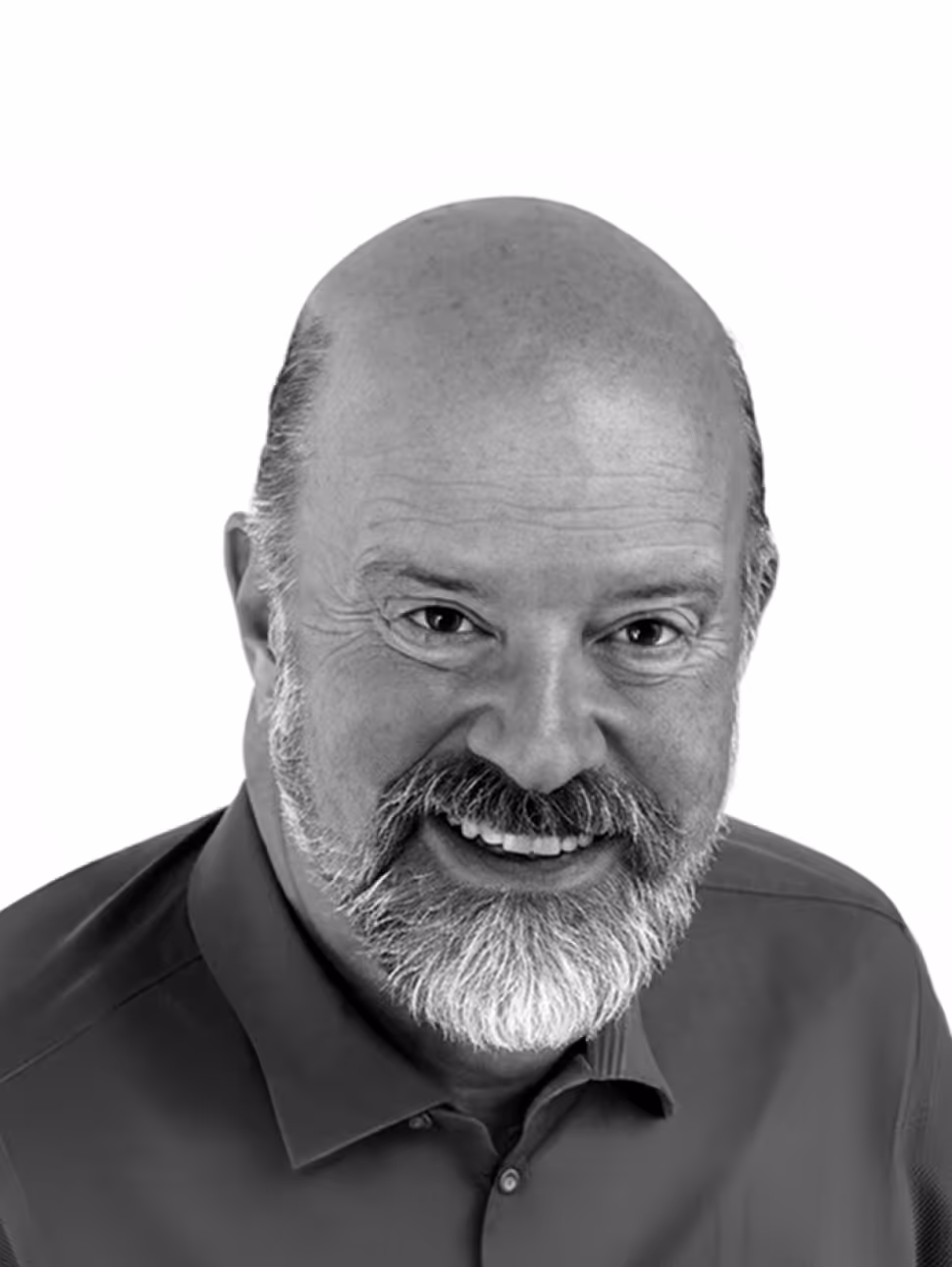 Smiling middle-aged bald man with a salt-and-pepper beard wearing a dark collared shirt.