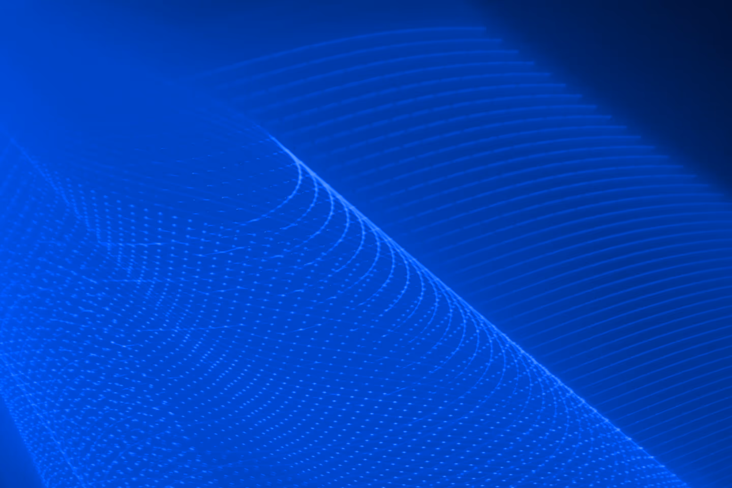 A smooth spherical white object with subtle reflections against a blue background with faint gridlines and abstract wave patterns.
