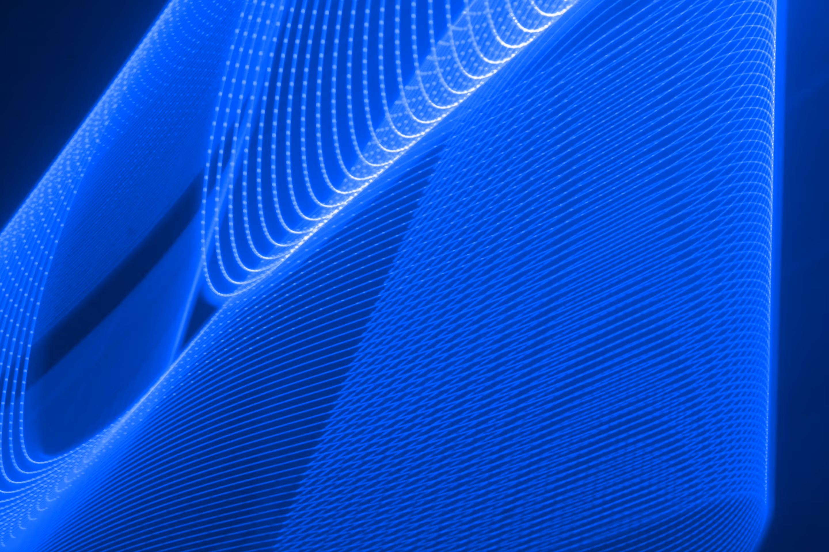 White sphere with soft pink and blue gradients centered on a deep blue background with subtle grid wave patterns.