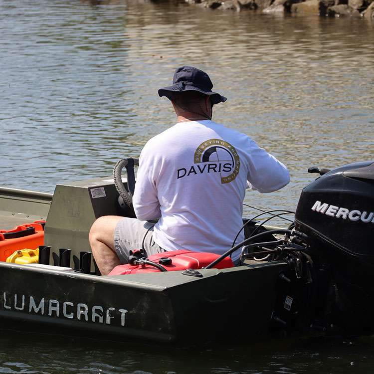 Surveying professional operating equipment during a waterfront survey for Davris in Florida.