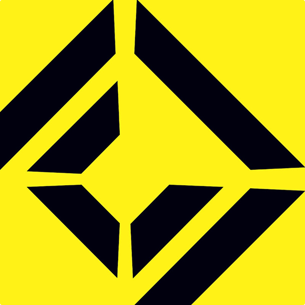 Smiling middle-aged man wearing a dark coat in a warmly lit indoor setting.