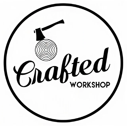 Smiling middle-aged man wearing a dark coat in a warmly lit indoor setting.