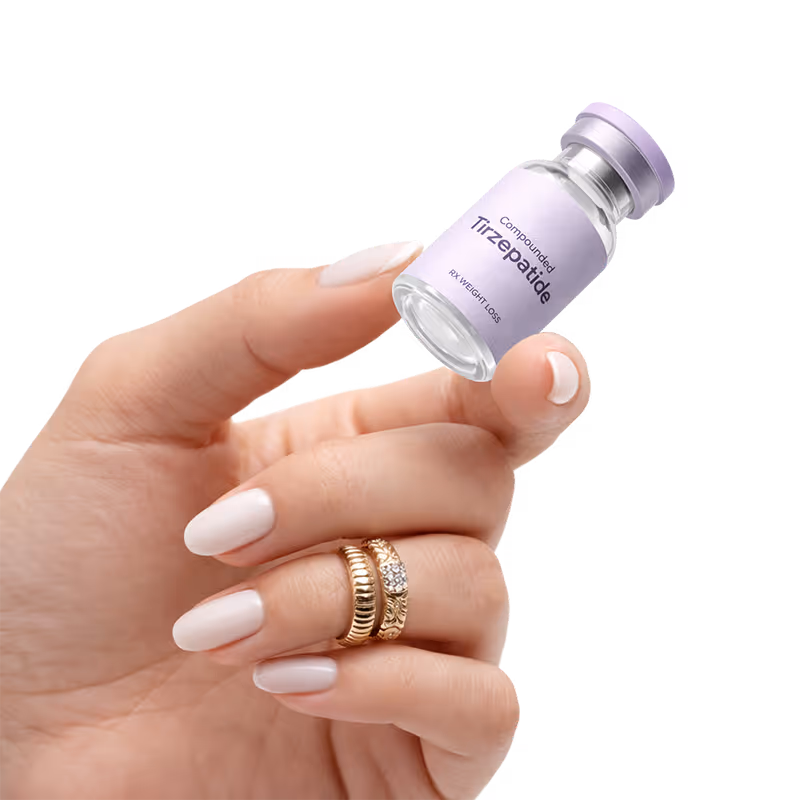 Hand holding a small vial labeled 'Compounded Tirzepatide RX Weight Loss' with light purple cap and label.