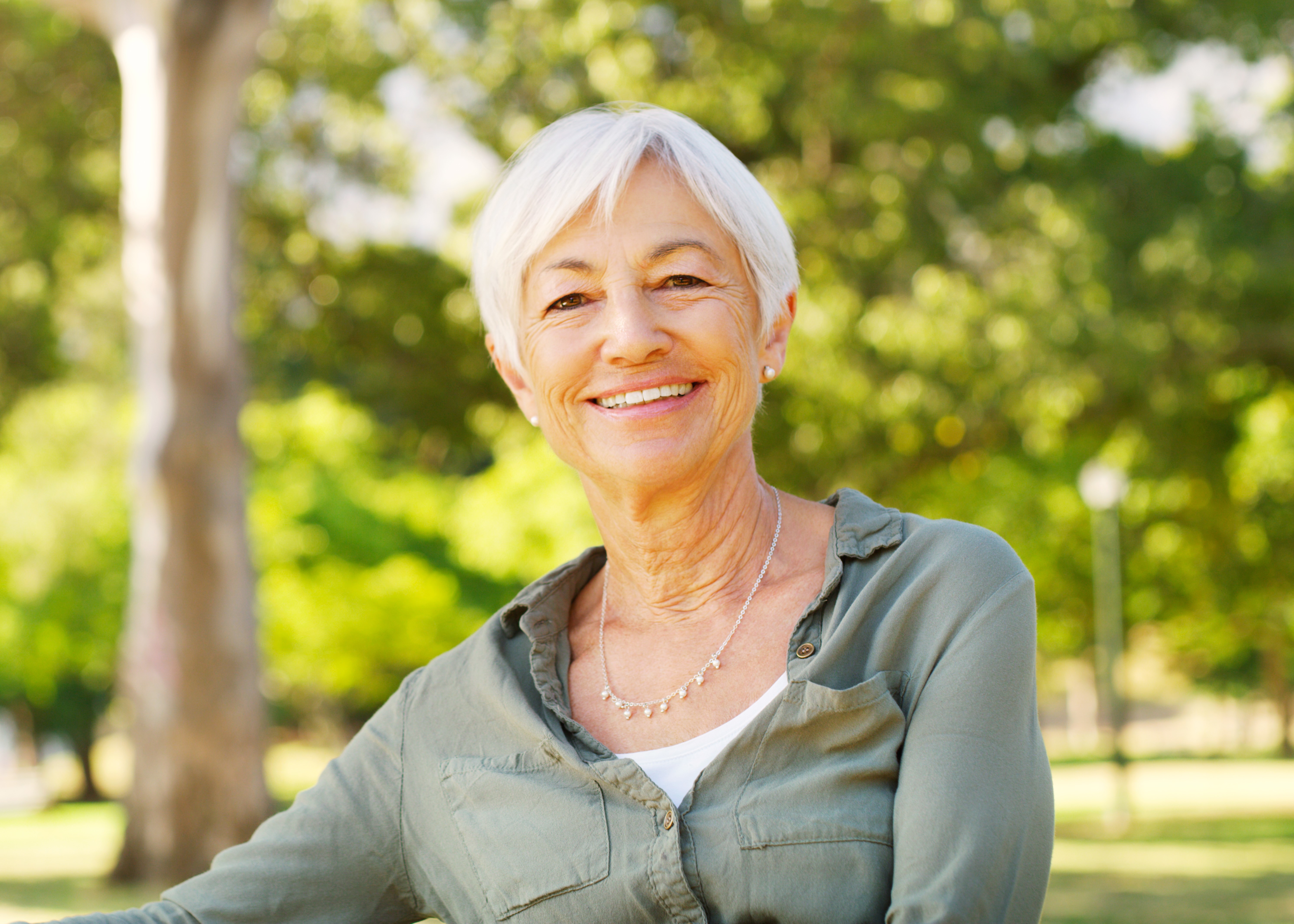 older woman in green shirt