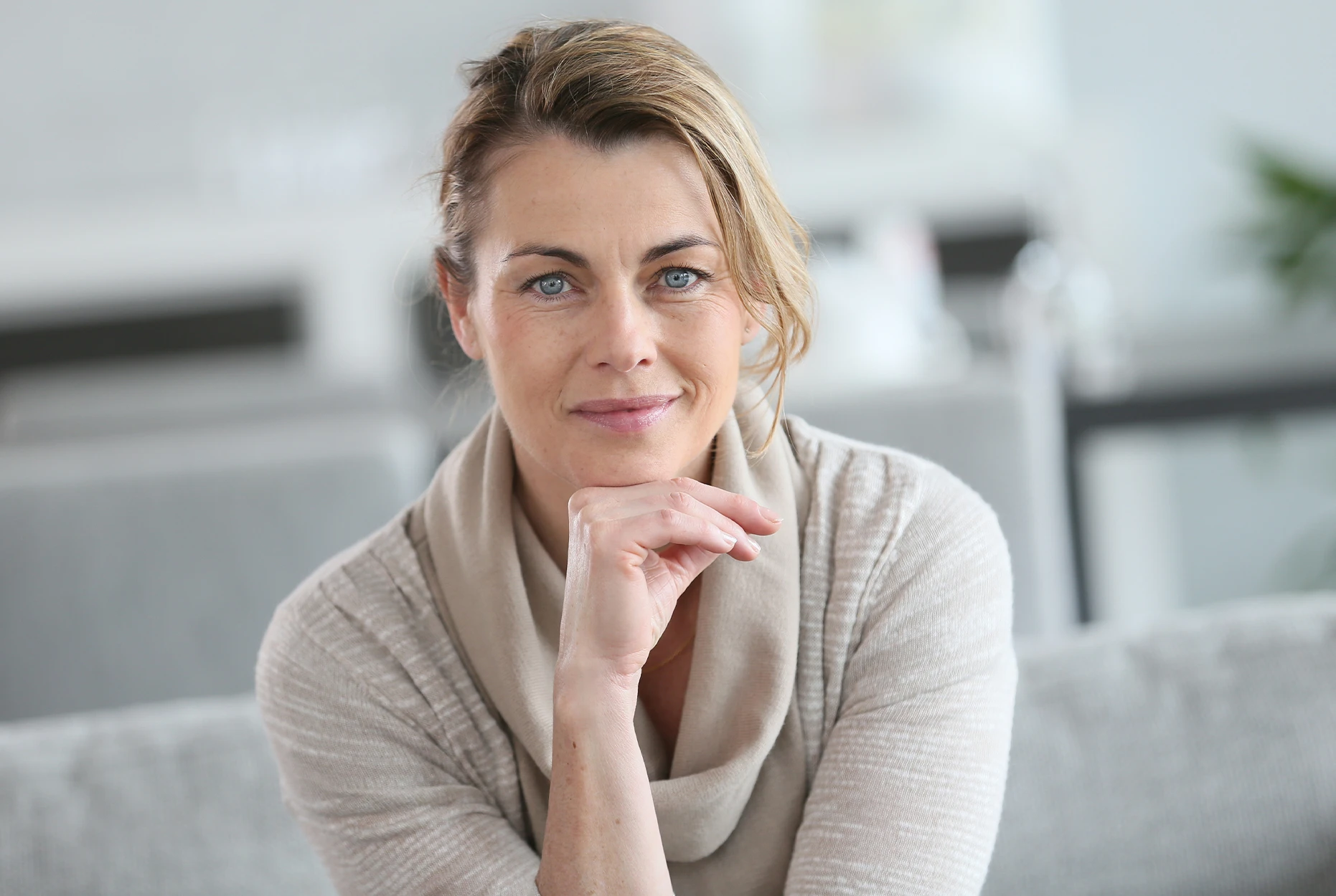 Side-by-side profile photos of a middle-aged woman showing before and after a cosmetic procedure that tightens and smooths the skin around her jawline and neck.