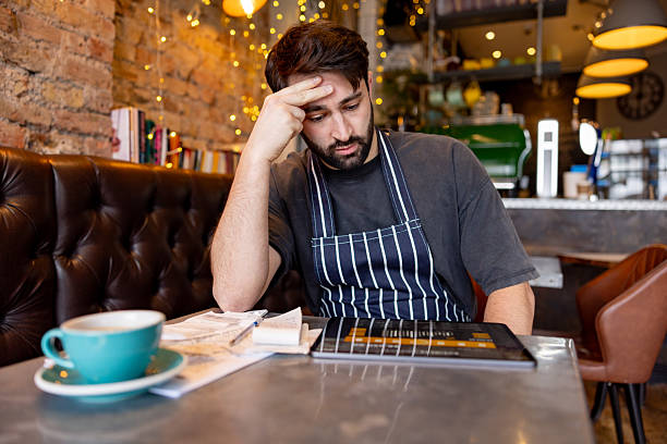 Restaurant manager reviewing profit-and-loss and labor performance.