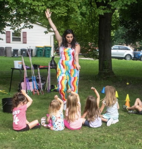 Bubble artist demonstrating giant bubbles outdoors
