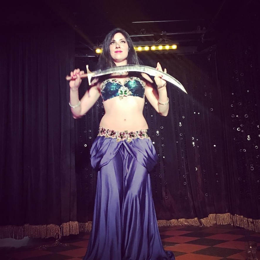 Belly dancer in vibrant Egyptian costume at a Maryland celebration