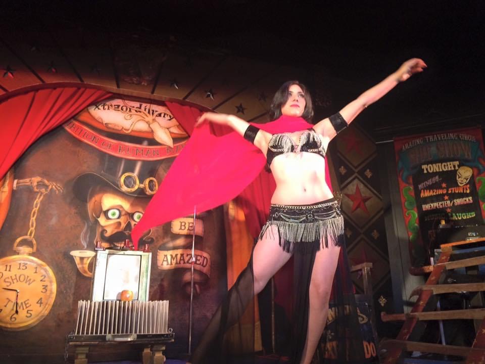 Belly dancer performing a sword balance routine at a wedding