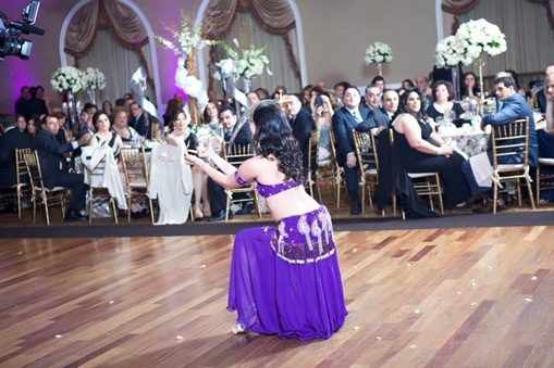 Belly dancer in flowing veil during a performance