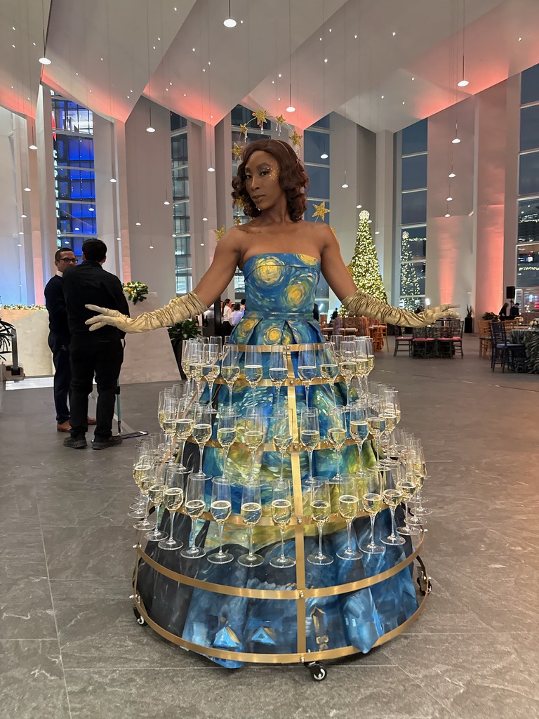 Champagne skirt performer at a cocktail hour