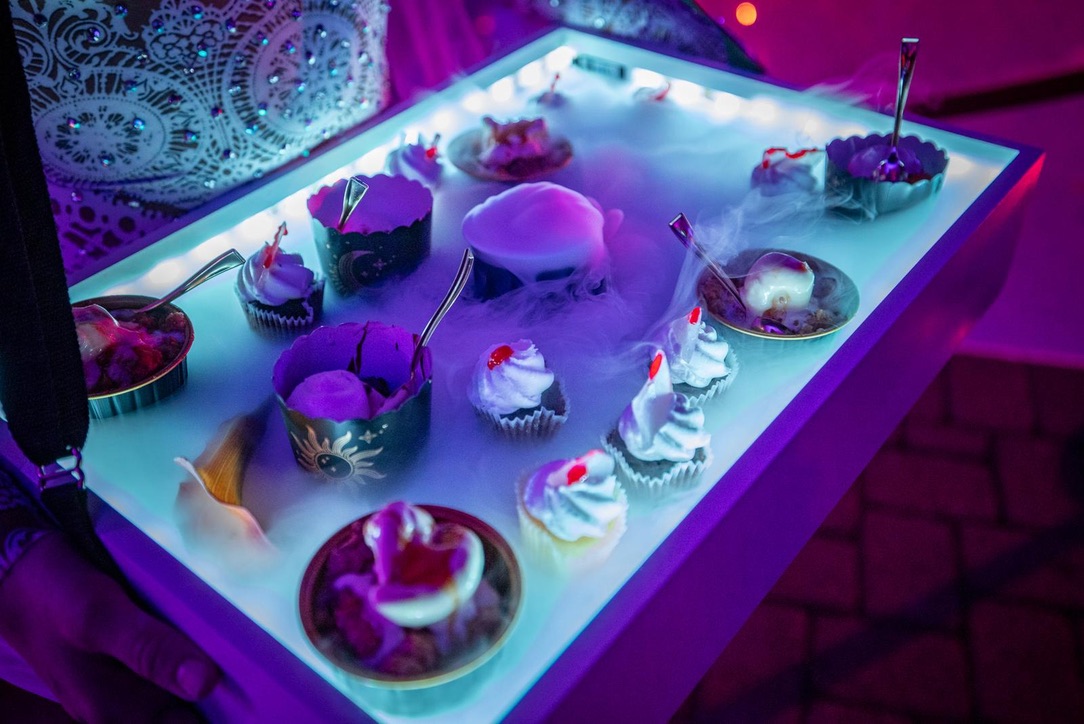 Dry ice serving tray with dramatic fog effect at an event