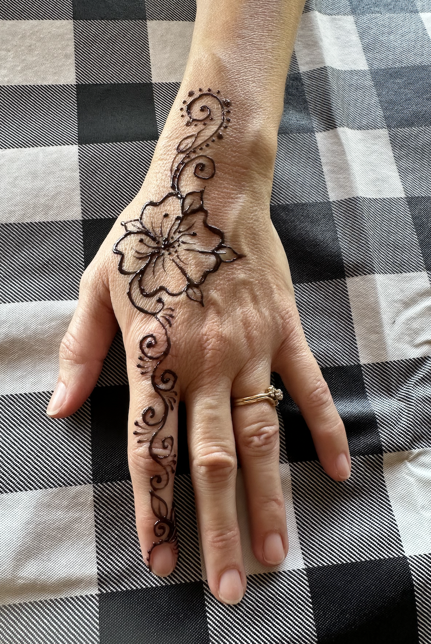 Modern boho henna design at a DC festival