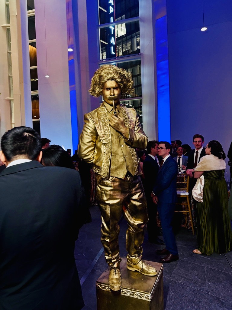 Gold-painted living statue at a Washington DC museum opening