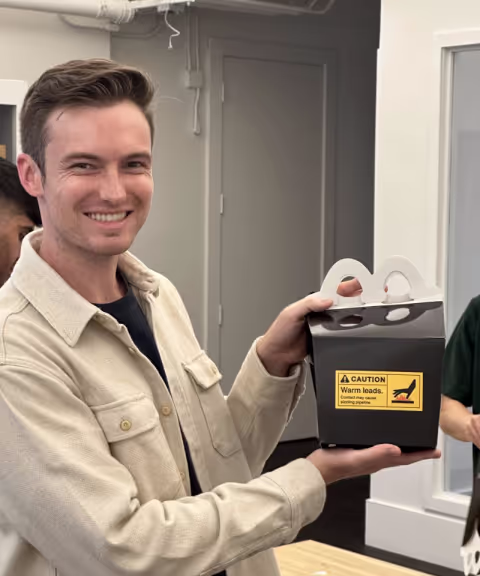 Conor holding team prizes