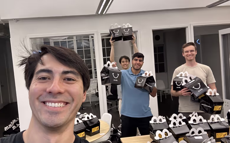 Austin and team selfie posing with prizes.