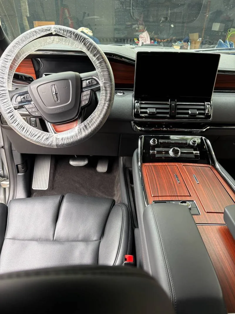 Expert mobile interior detail service close-up on steering wheel and cockpit in Boerne TX Hill Country