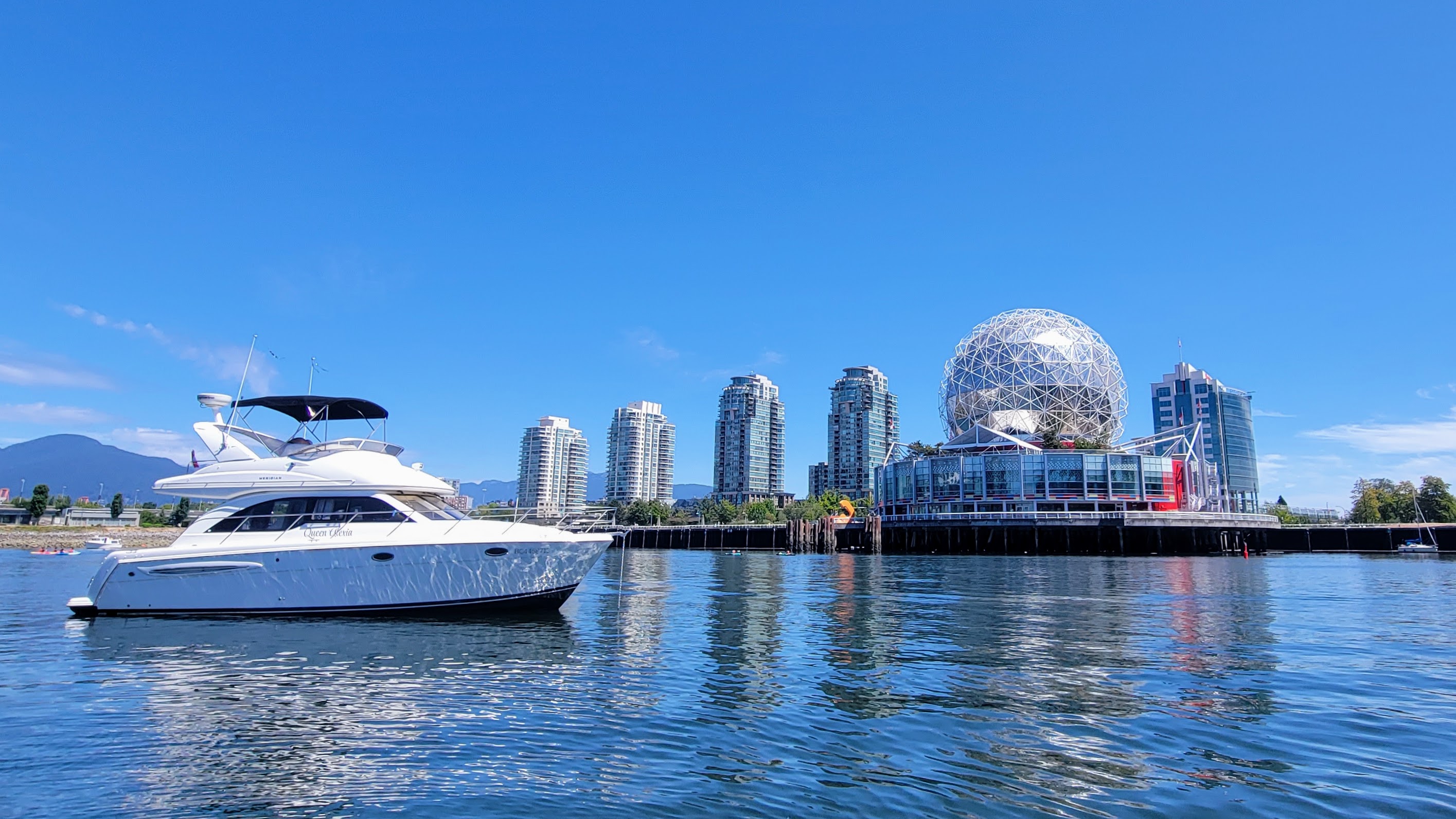 Yacht in front of Science World
