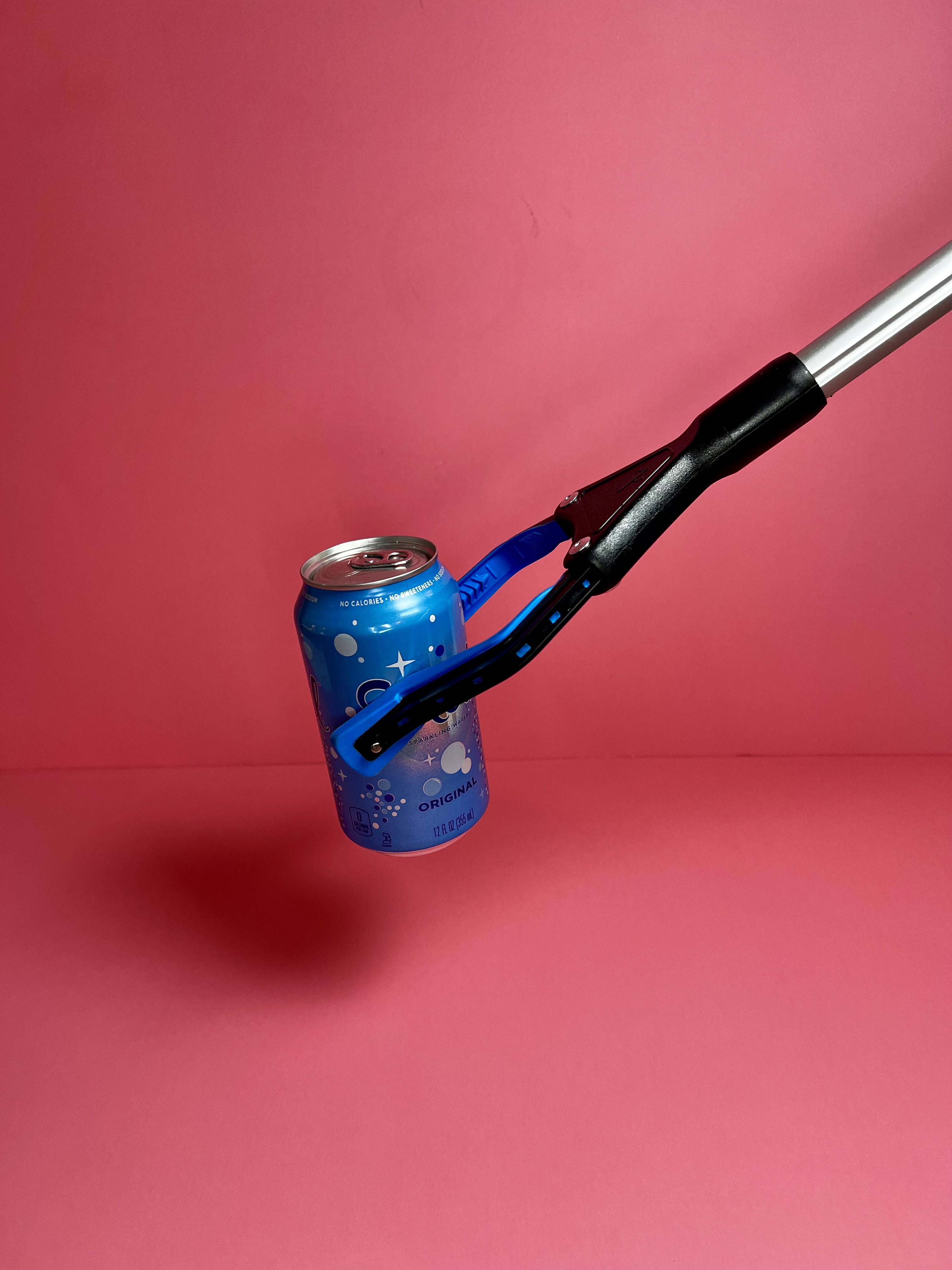 Weighted silverware arranged around a white plate on a blue background.