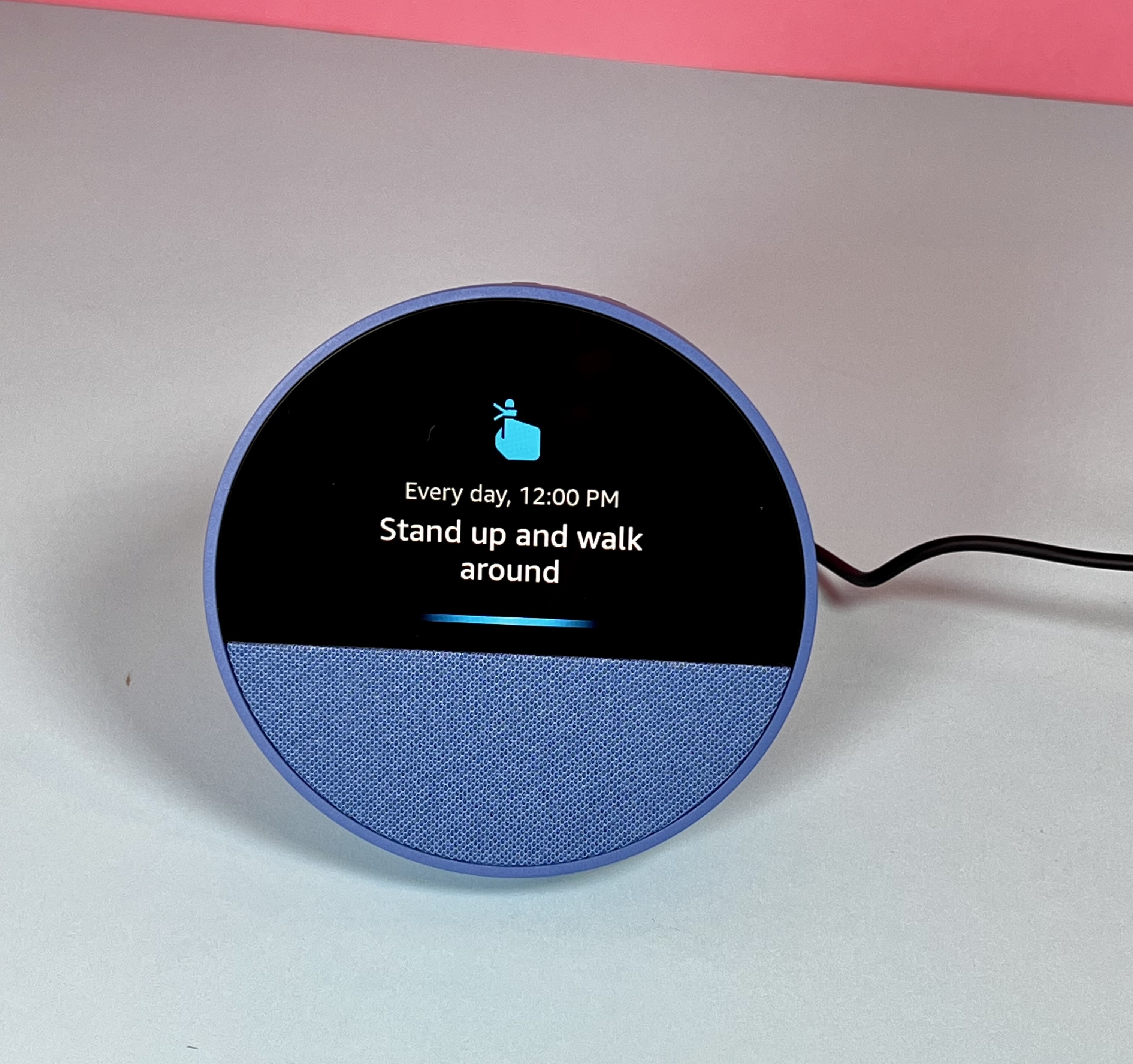 Amazon Echo Show displaying a daily reminder to stand up and walk around
