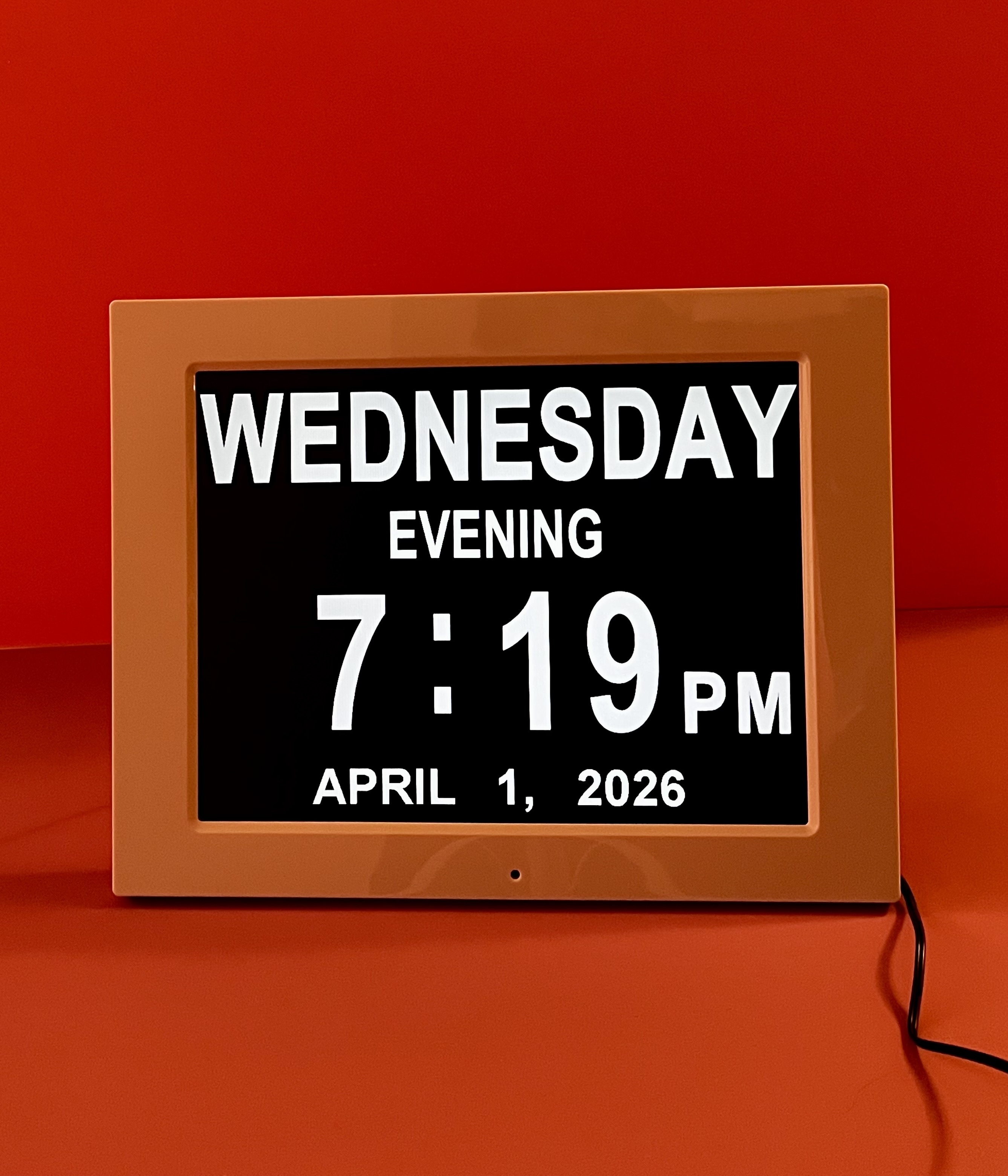Digital day clock displaying Wednesday evening, 7:19 PM, April 1, 2026.