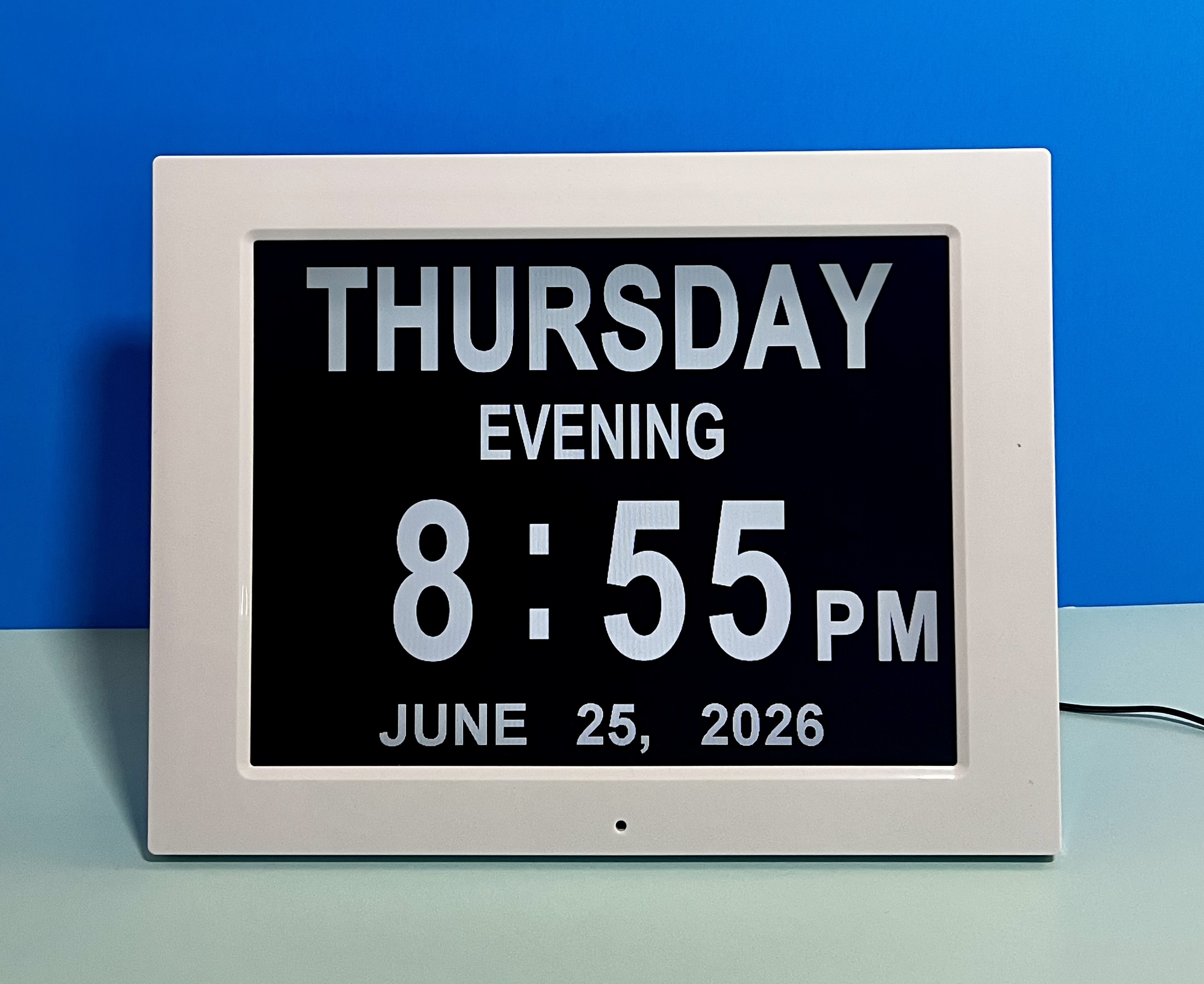 Digital day clock displaying Thursday evening, 8:55 PM, June 25, 2026.