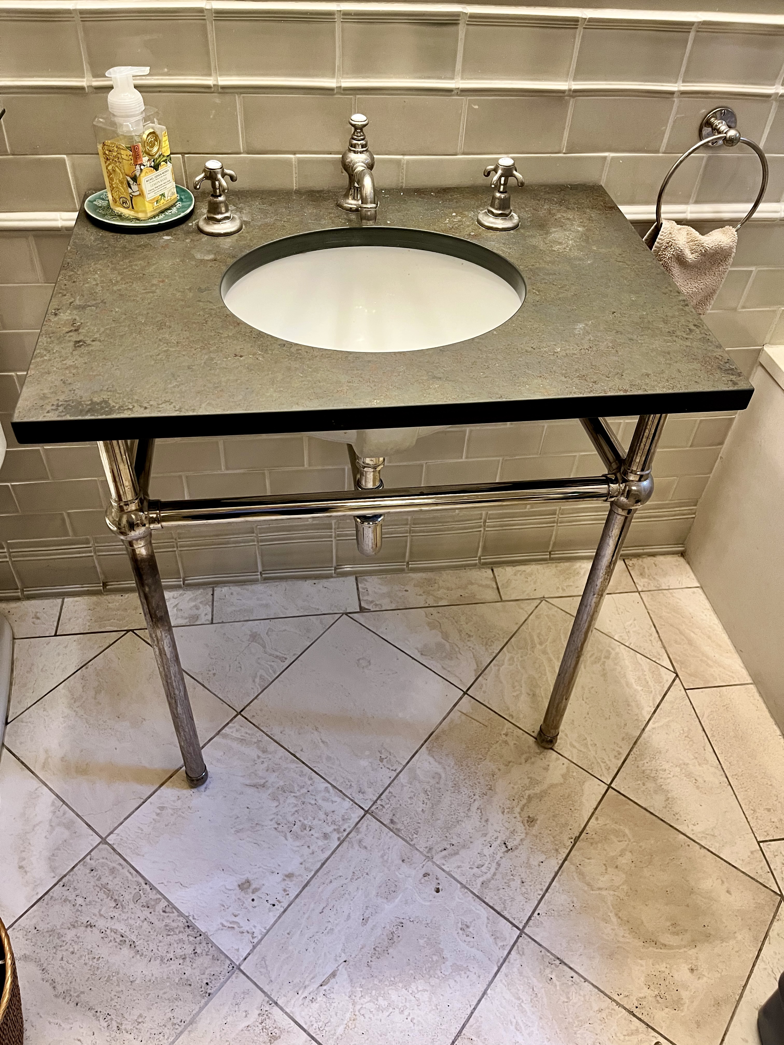 Bathroom vanity with open space underneath.