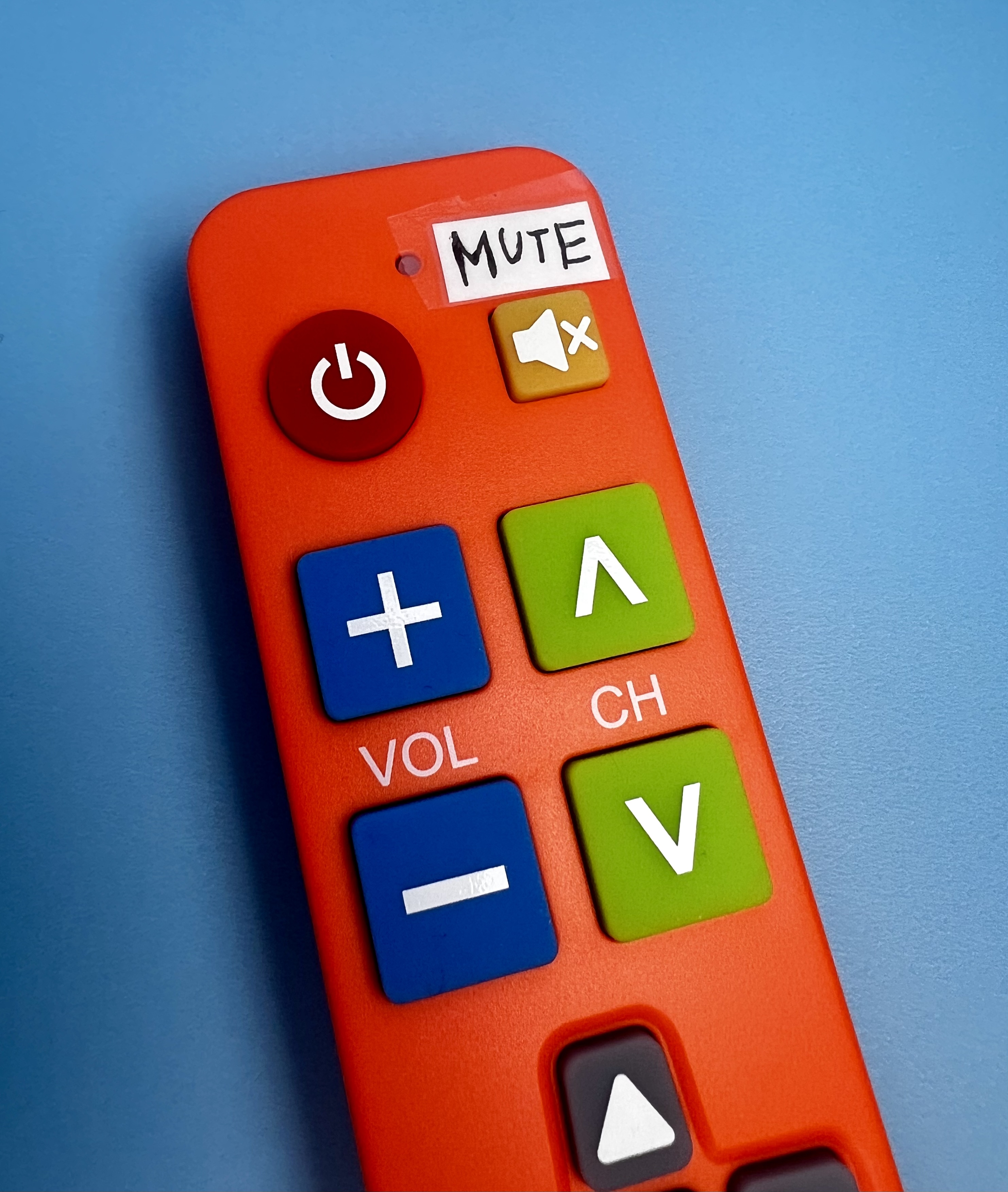 Orange remote with large buttons and a clear “MUTE” label added above the mute button for easy reading.