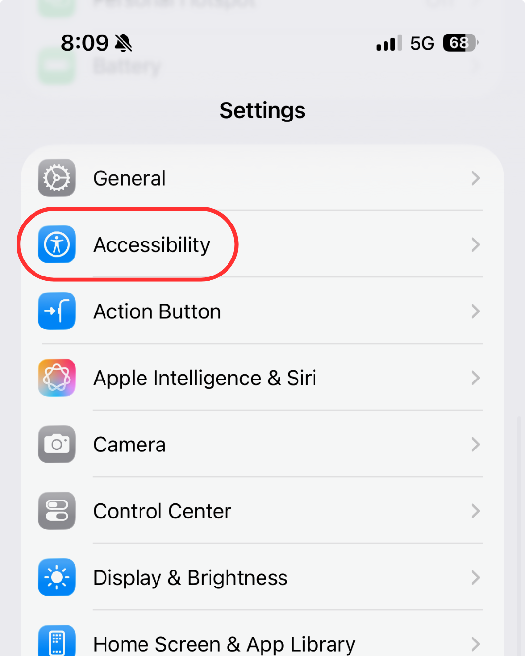 The Settings menu on an iPhone with a red circle highlighting the "Accessibility" option.