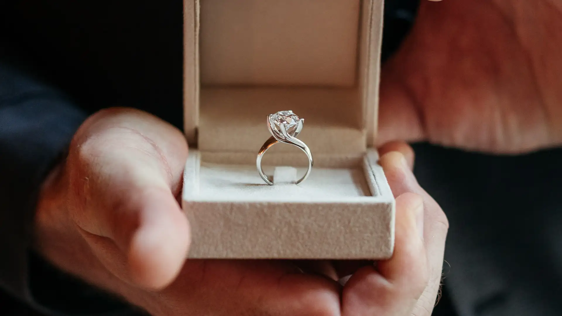 Engagement ring in a box during a marriage proposal in Milan