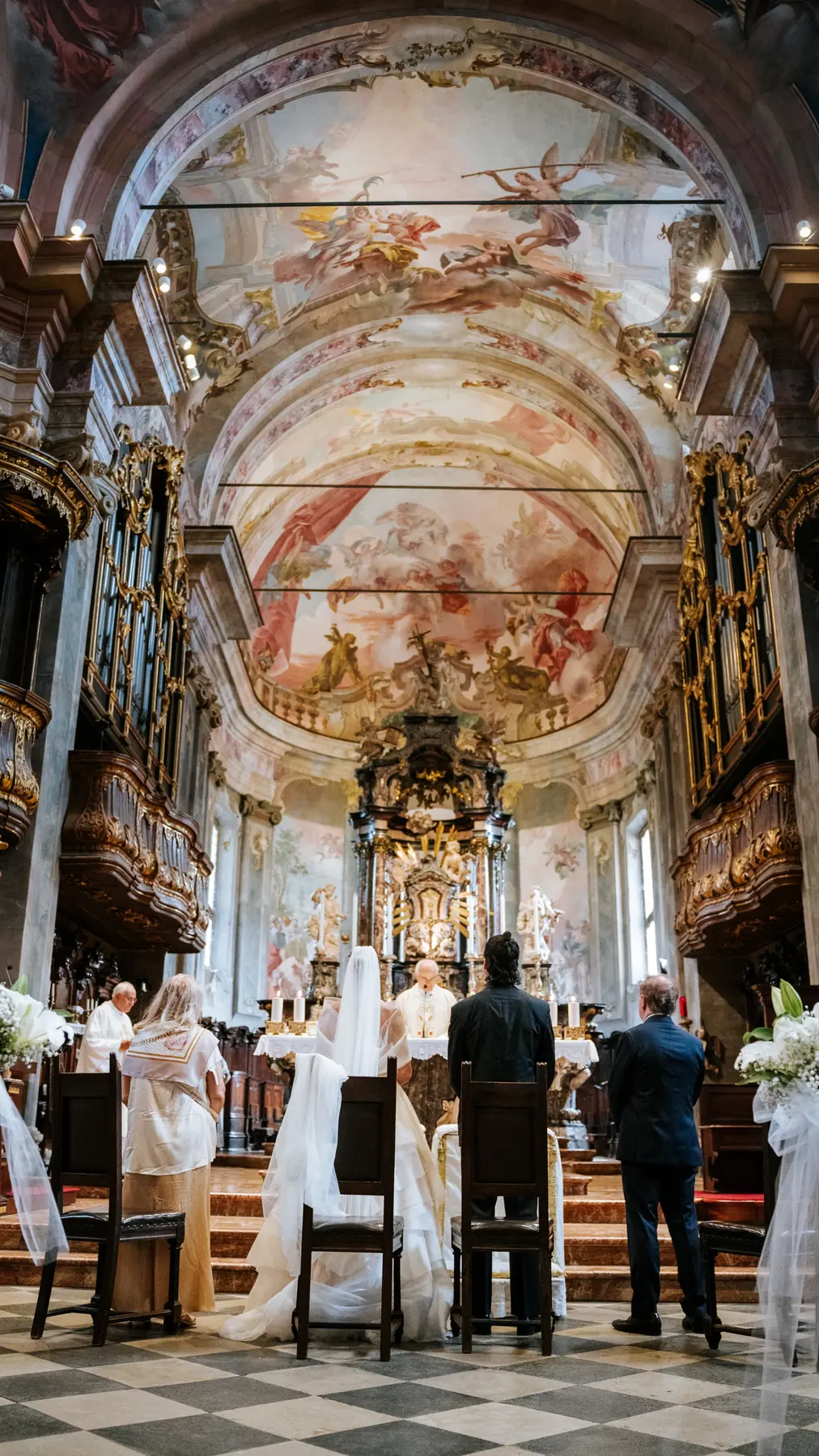 Wedding ceremony inside a frescoed baroque church, Lake Maggiore, Italy