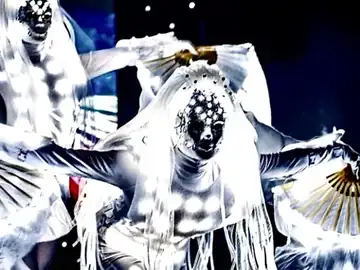 Performers in LED costumes