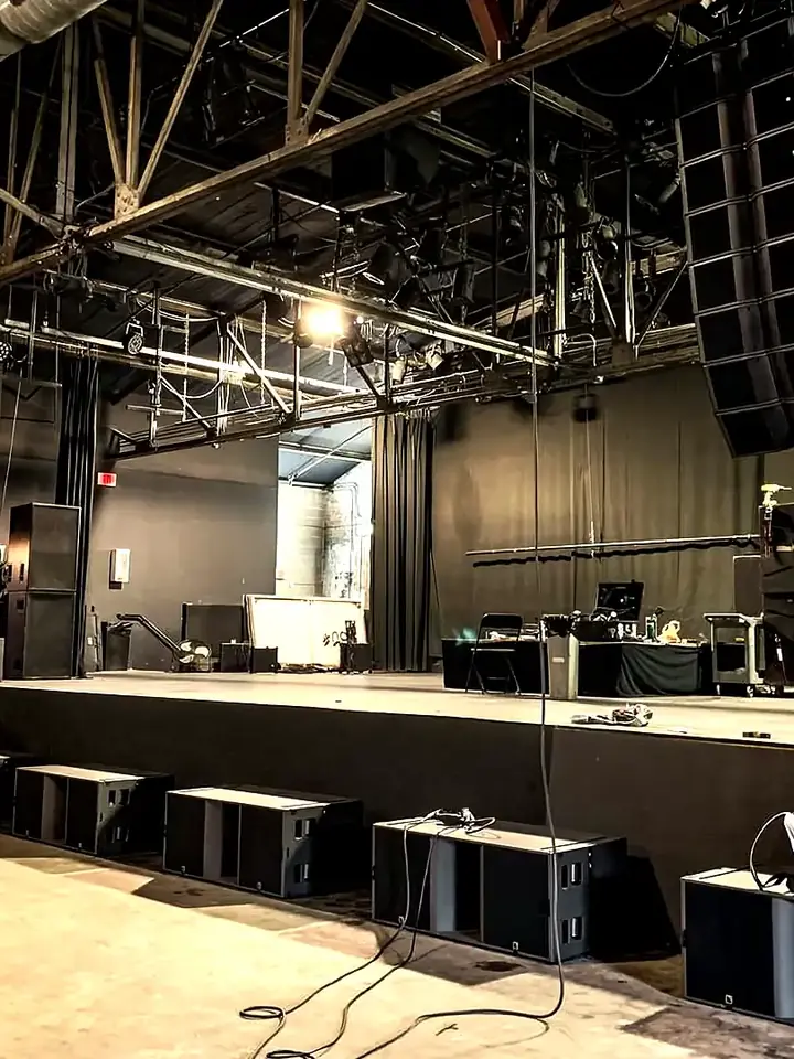 Stage, sound desk and speakers set for an event