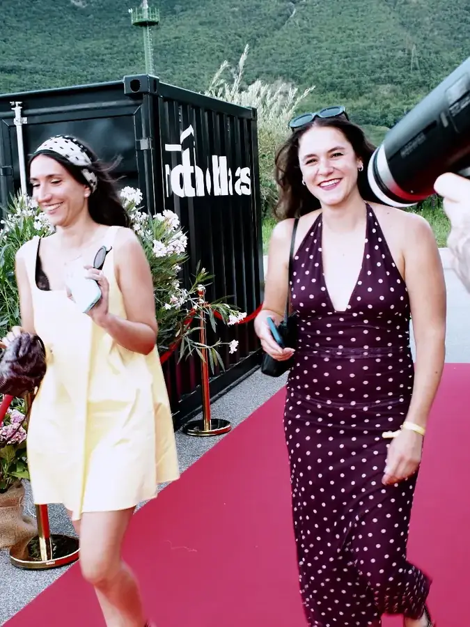 Guests arriving on the red carpet at a corporate event