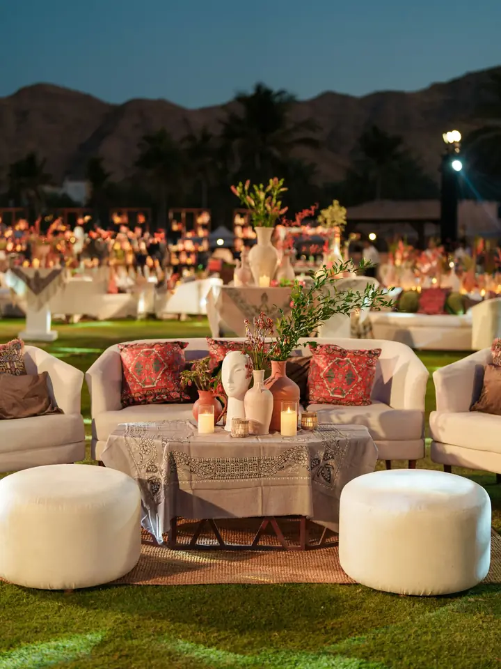 Evening lounge set with sofas, candles and flowers