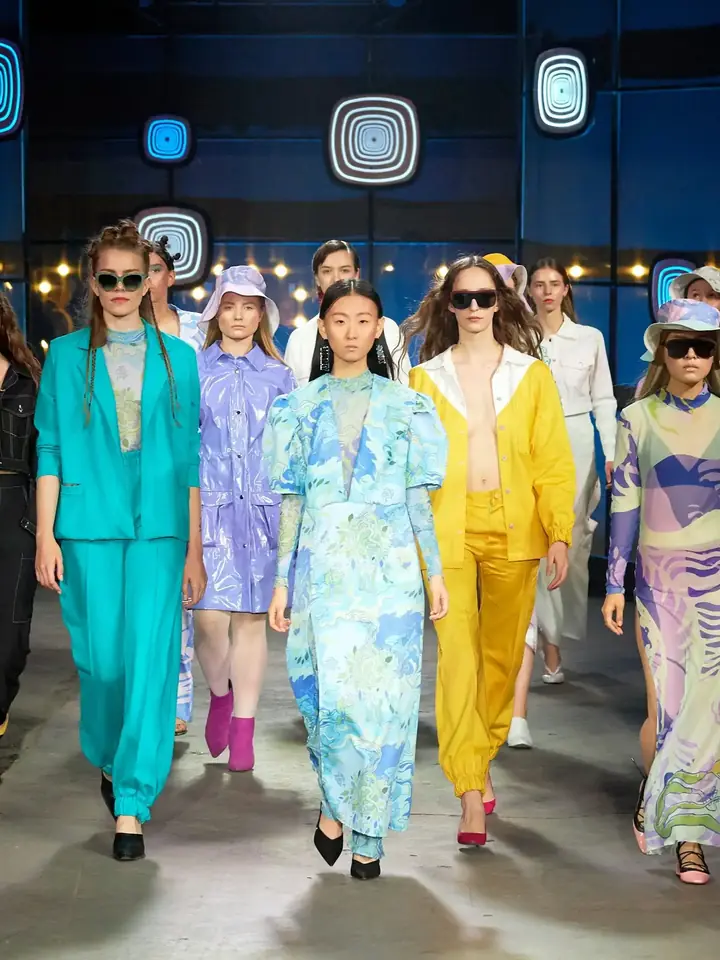 Models walking the runway at a fashion show in Dubai