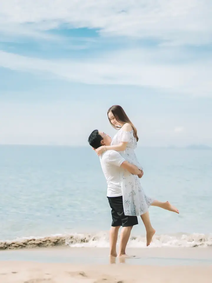 Couple celebrating on a Dubai beach