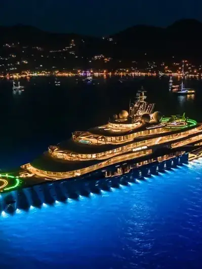 Yacht lit up at night off Dubai
