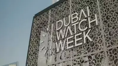 Dubai Watch Week sign on a laser cut metal facade