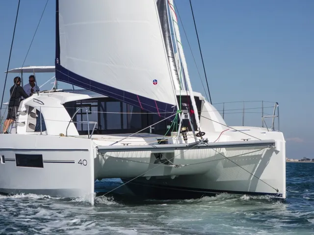 Sailing catamaran under way with guests on deck