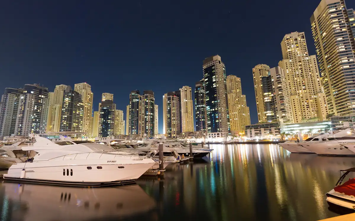 Motor yachts in Dubai Marina at night