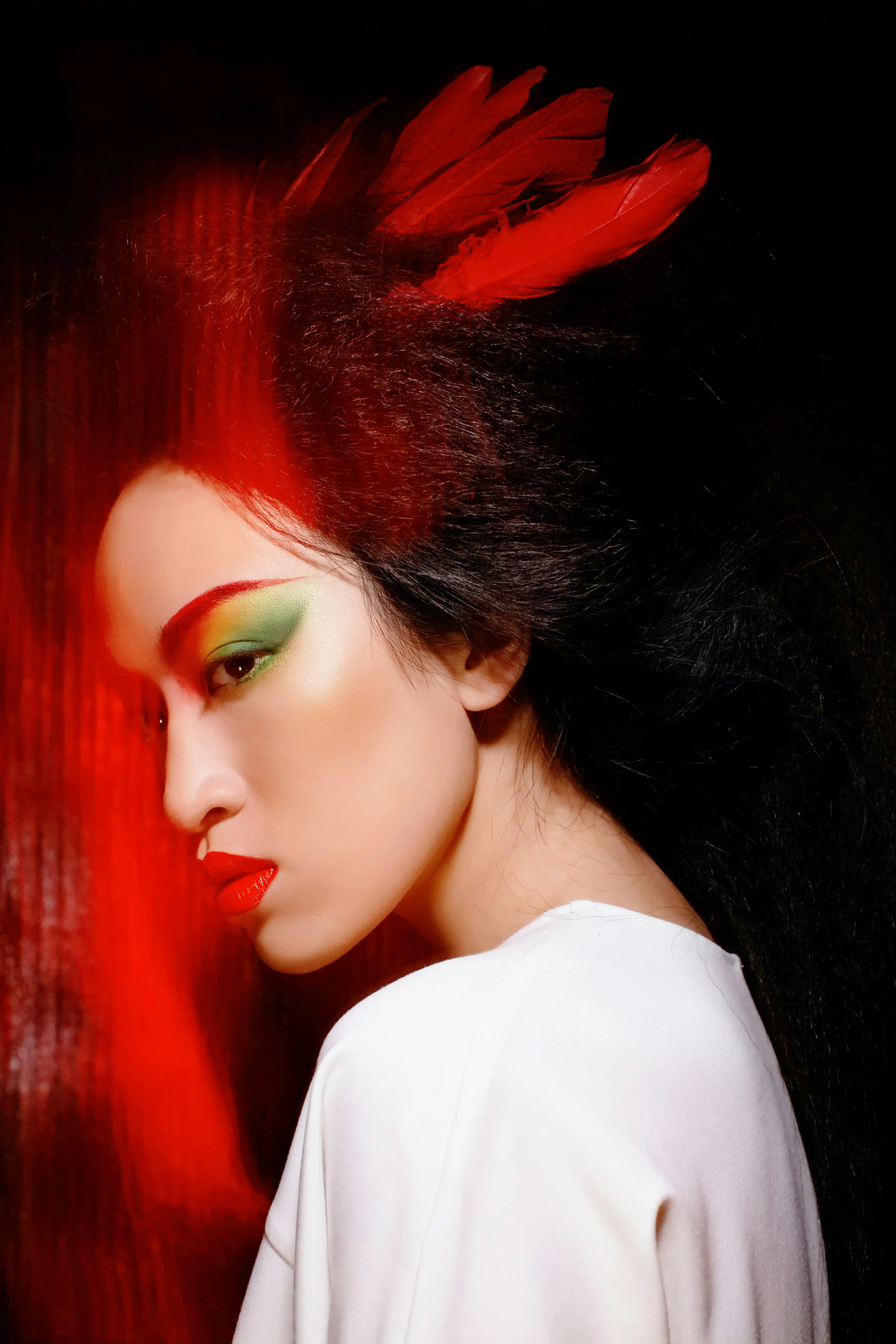 Elegant wavy-haired hairdresser performer in black and white side profile for Coverpage talent agency in Dubai.