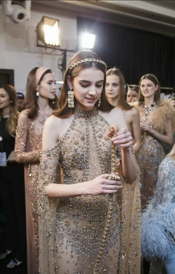 Fashion model talent in Dubai - Coverpage agency luxury couture backstage golden gown