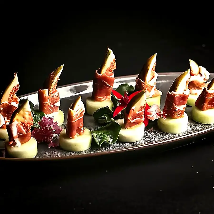 Gourmet canapés on a serving board, event catering by Cover Page Agency