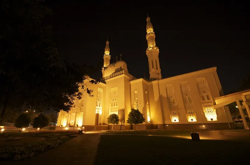 Jumeirah Mosque in Dubai lit in warm light at night