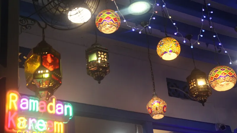Coloured Ramadan lanterns and a Ramadan Kareem light sign